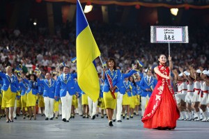 BEIJING - AUGUST 08: Swimmer Yana Klochkova of Ukraine carries her country's flag during to lead out the delegation during the Opening Ceremony for the 2008 Beijing Summer Olympics at the National Stadium on August 8, 2008 in Beijing, China.  (Photo by Paul Gilham/Getty Images)
