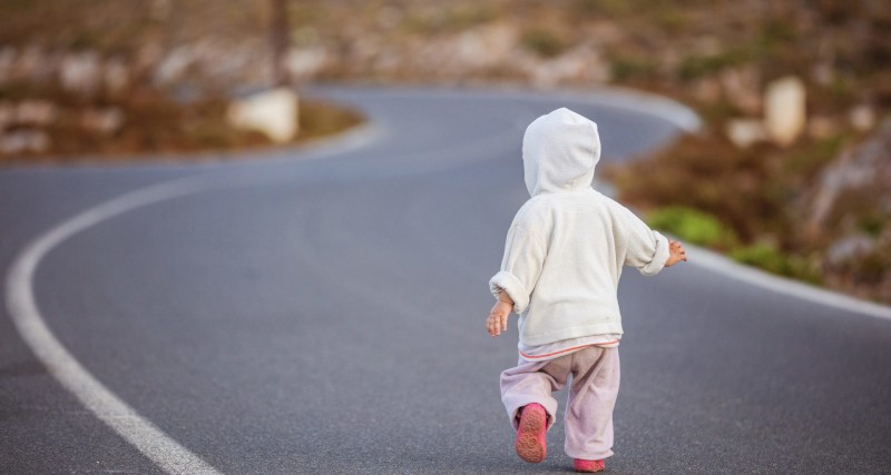 little-girl-running-down-road-in-countryside-1920x1024